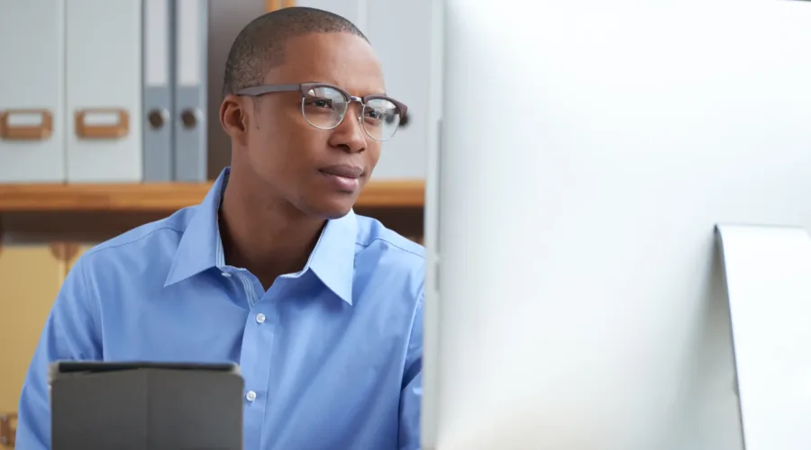 School administrator using school management software to plan for the new term